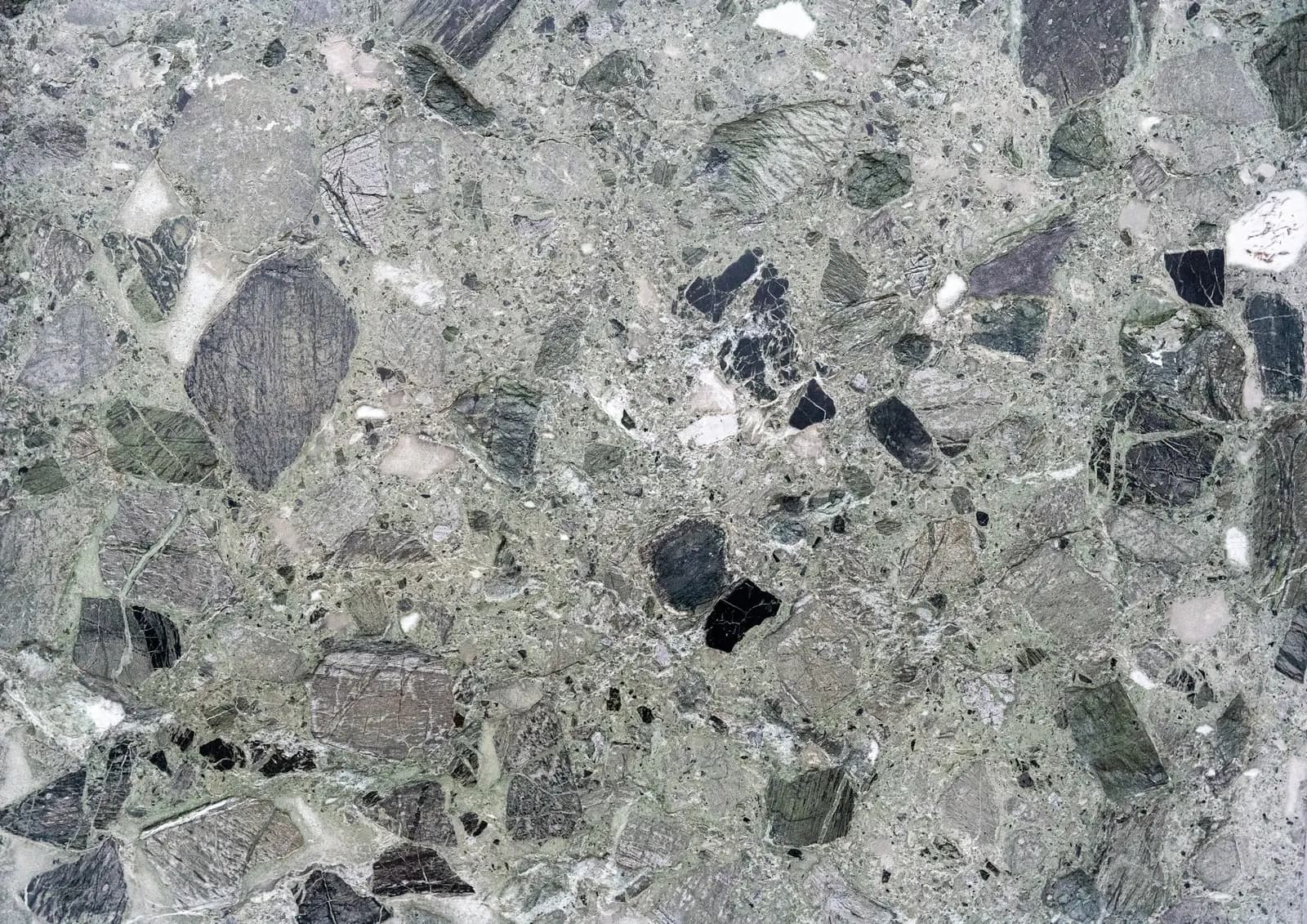 Concrete surface showing cream, light and full aggregate exposure