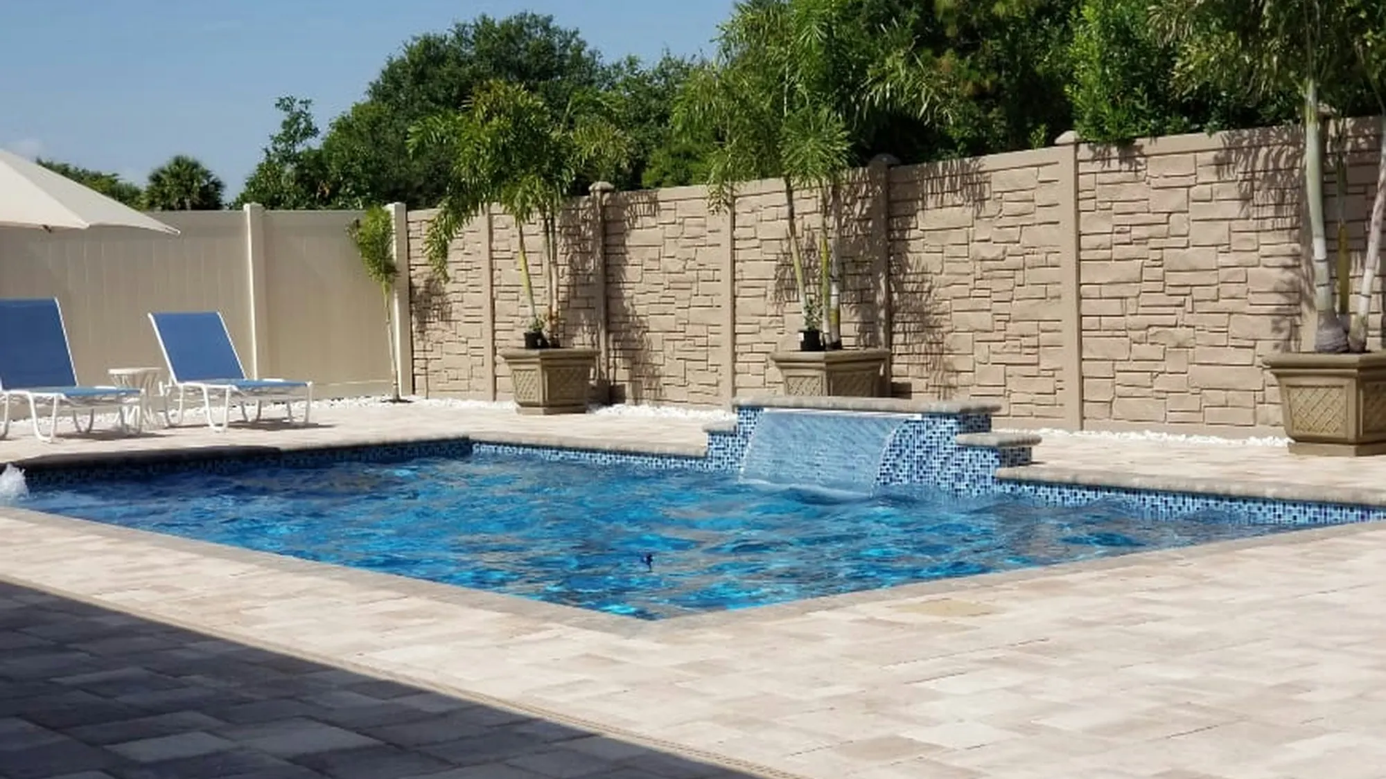 Concrete pool surround finished by Clutch Construction