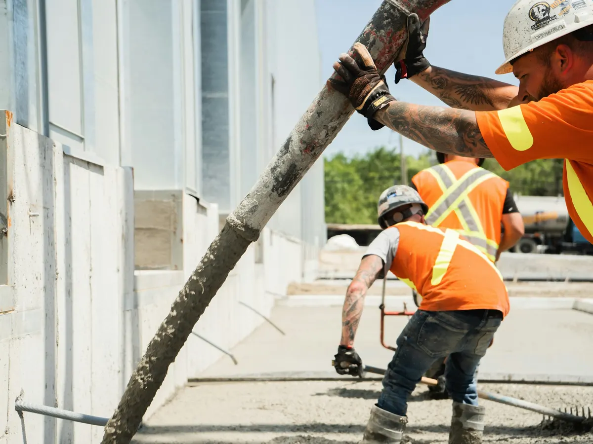 Crew finishing a concrete slab pour