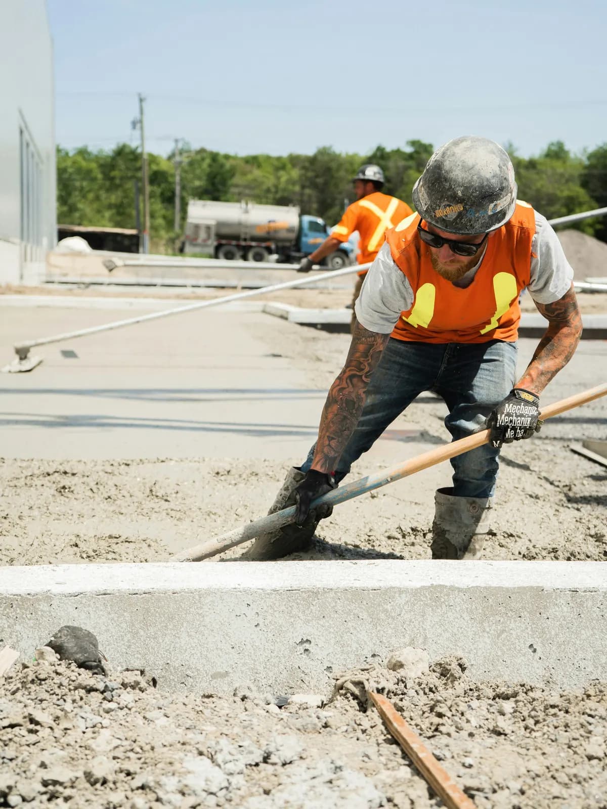 Clutch Construction crew finishing concrete