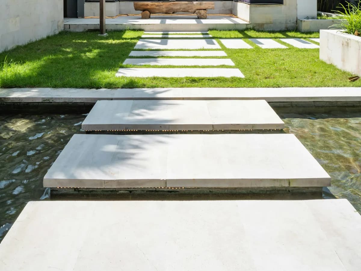 Concrete patio and pool surround at a home